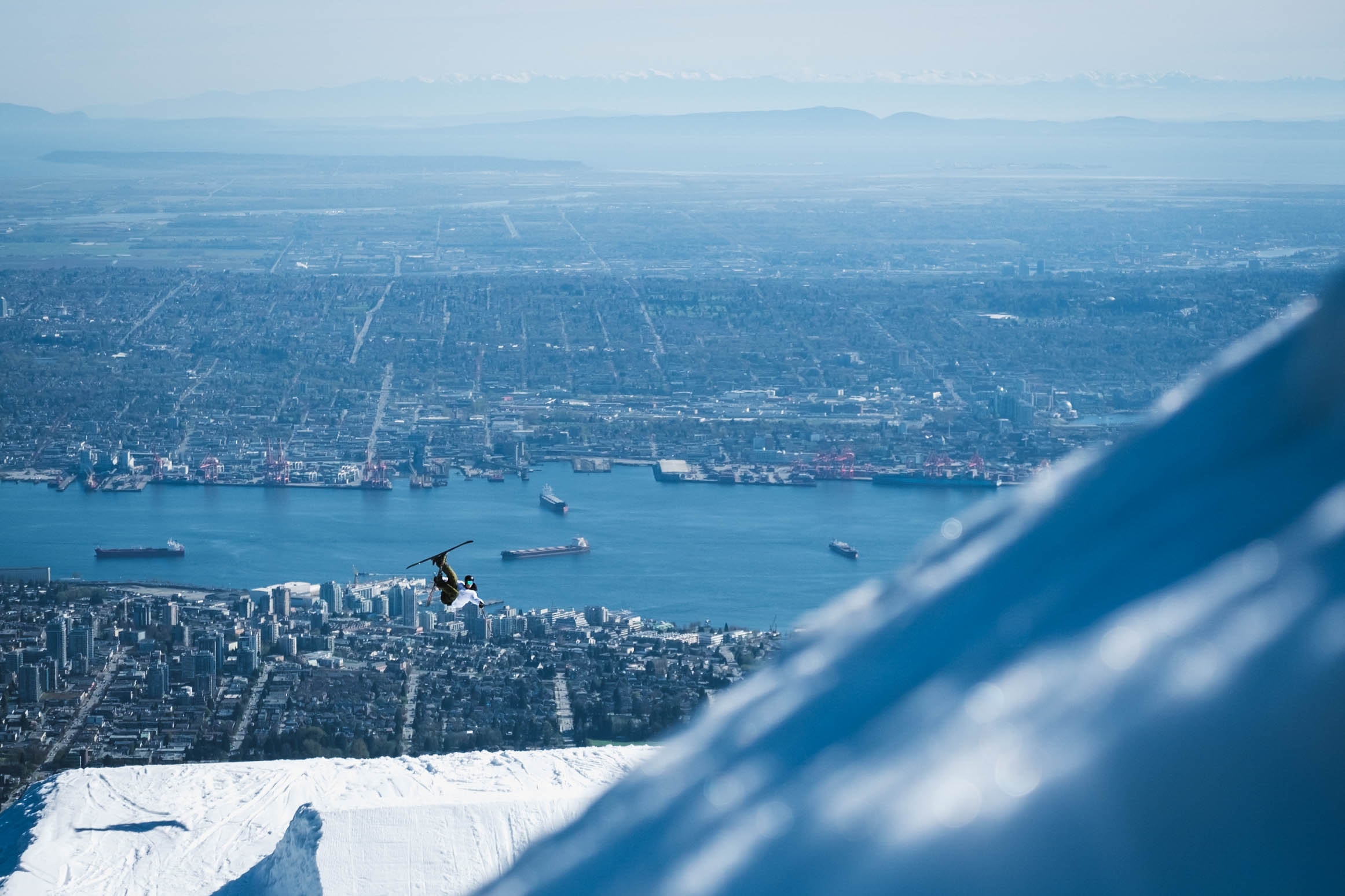 Grouse mountain downtown harbour Vancouver city view snowboarder